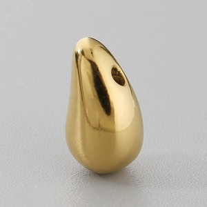 Macro shot of 12x6mm teardrop pendant with smooth polished gold titanium steel finish