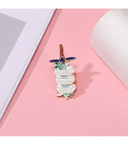 Detail view of enamel sword brooch with Fighting Invisible Battles text on pink background