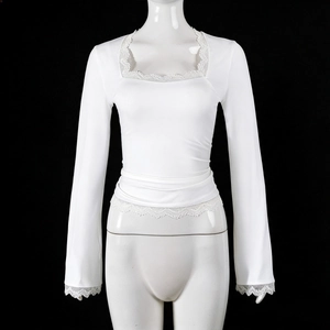 Macro shot of white slim-fit top featuring square neckline with delicate lace trimmings