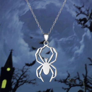 Detailed view of silver stainless steel spider necklace in Gothic Halloween themed setting