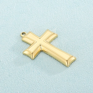 Polished gold Egyptian Ankh cross pendant made of stainless steel on light blue background