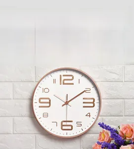 Detail of 10-inch wall clock featuring rose gold 3D embossed numbers on a white dial