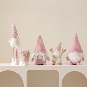 Pink and white Christmas gnomes plush set with lights for holiday tabletop decoration