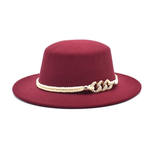 Flat top burgundy wool fedora hat with white braided rope and golden chain detail