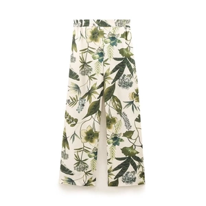 Women's summer wide-leg pants with tropical green and yellow floral print on white background