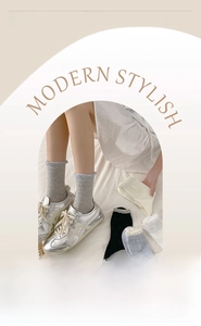Detail of soft cotton crew socks with bow jacquard and ruffled elastic cuffs in grey