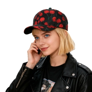 Fashionable black baseball cap with red cherry jacquard pattern worn with leather jacket