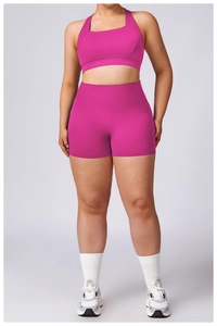 Detail of rose red high-waist yoga shorts and matching racerback sports vest