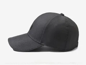 Side view of dark gray canvas baseball cap showing detailed fabric texture and logo