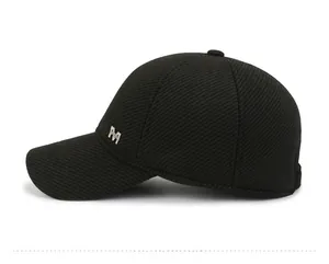 Close-up of black baseball cap side with silver metal M Sport letter emblem decoration
