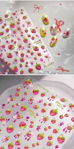 Macro detail of 3D embossed strawberry nail art stickers with glossy jelly texture