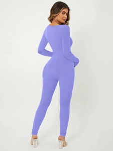 Detail view of purple ribbed knit unitard showing bodycon fit and long sleeve texture