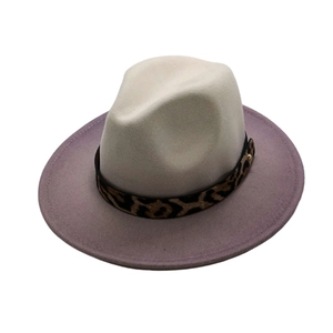 Close-up of cream fedora hat featuring a leopard print band and lavender wide brim