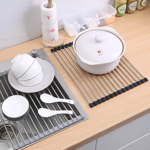 Foldable stainless steel sink drying rack with black silicone edges for kitchen storage