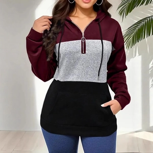 Detail of color block hoodie with burgundy, grey and black panels and a half-zip closure