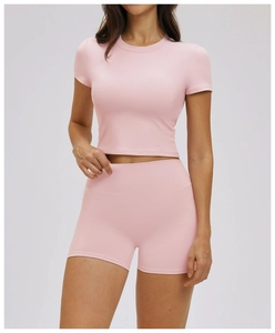 Close-up of pink slim fit yoga crop top with textured high-elasticity sports fabric