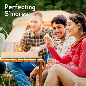 Tabletop rectangular ethanol fireplace used for roasting marshmallows in outdoor camping