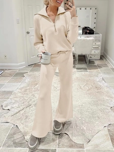 Detail of apricot two-piece lounge set with half-zip sweatshirt and wide-leg trousers