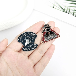 Plague Doctor crow enamel pins with Don't Be Afraid and No More Germs slogans