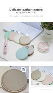 Close-up of colorful round faux leather mirrors with fine texture and silver metal rings