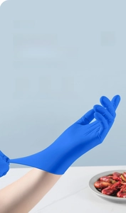 Detailed shot of heavy duty blue nitrile glove showing high elasticity and tear resistance