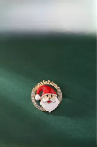 Detailed view of Christmas elk and Santa pins with dimensions 3.9x4cm and 3.8x3.5cm