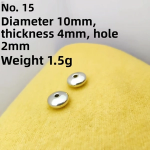 Detailed view of 10mm silver spacer beads with 2mm hole for DIY jewelry making