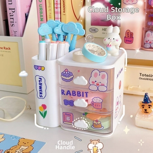 Close-up of cloud-shaped handles and cute cartoon stickers on a pink desktop organizer