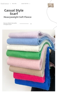 Detailed texture of thick mohair knit scarves with fringe in multiple vibrant colors