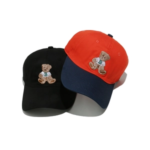 Black and color-block baseball caps with bear embroidery and curved brim for women