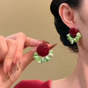 Artistic shell-patterned geometric round stud earrings in burgundy and green color contrast
