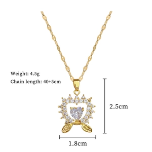Detail of gold heart and bow pendant with product dimensions and weight specs