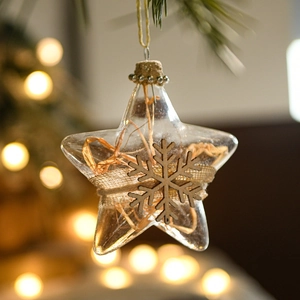 Clear star-shaped Christmas ornament with wooden snowflake and hemp rope hanger decoration