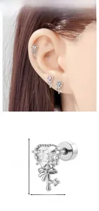 Close-up of heart key cartilage stud with zircon bow detail and 1.1cm height marking
