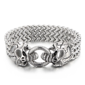 Punk style double skull head stainless steel braided bracelet in vintage silver finish