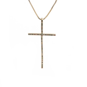 Detailed macro view of gold cross pendant with colorful zircon stones and box chain
