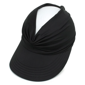 Detail of black sun visor featuring a pleated top design and wide reinforced brim for sports
