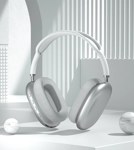 Detail of silver P9 Air Max wireless headphones featuring white mesh headband and ear cushions