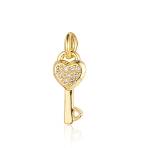 Detailed view of a gold heart-shaped key pendant set with sparkling cubic zirconia crystals