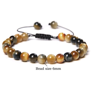 Detail of 6mm tiger eye stone beads and adjustable woven cord on yoga energy bracelet