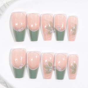Mid-length coffin press-on nails with pink base, green french tips and floral pearl accents