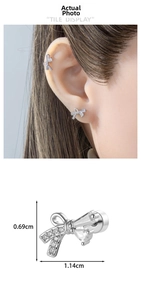 Detailed size view of bow cartilage earrings with micro-set zircon and silver finish