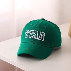 Close-up of premium green cotton baseball cap with 3D white STAR letter embroidery