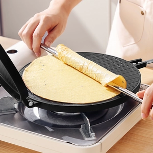 Non-stick manual egg roll maker on gas stove with long handle for home kitchen