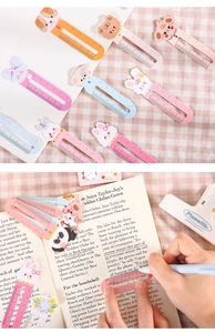 Close-up of cute cartoon animal bookmarks featuring a 5cm scale and pastel colors