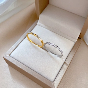 Minimalist titanium steel band rings in gold and silver with sparkling inlaid crystals