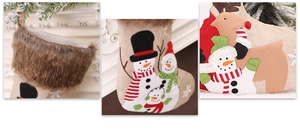 Detail of Christmas stockings in burlap with plush cuffs and festive snowman patterns