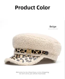 Close-up of beige fleece military cap featuring leopard print brim and gold M buckle