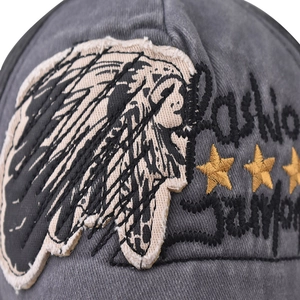 Macro detail of vintage washed cotton baseball cap with intricate embroidery and stars