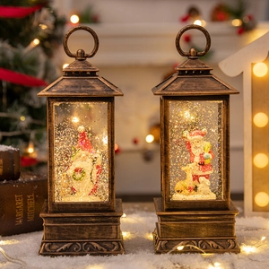Vintage bronze Christmas lanterns with glitter snow globe scenes and warm festive lighting